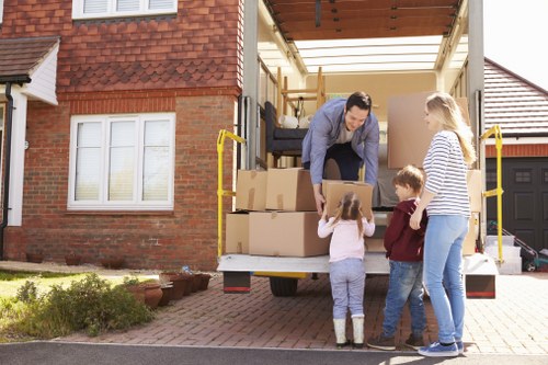 House removalists helping a Surrey home move with boxes and furniture