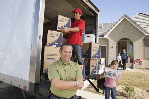 Office relocation service with desks and equipment being moved