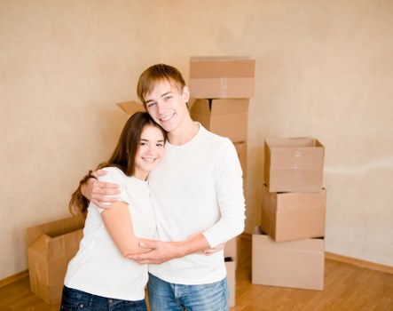 Furniture pick-up team handling bulky items at a Surrey home