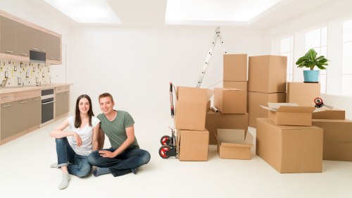 Furniture being carefully carried during a Surrey relocation