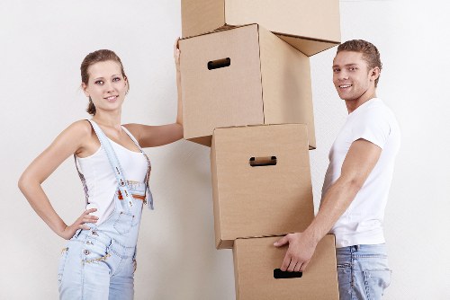 Professional packers organizing boxes for a local move in Surrey