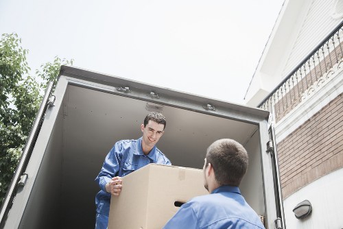 Loading household furniture into a removals van in Surrey