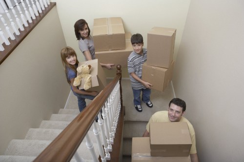 Professional movers loading furniture for a local Surrey relocation